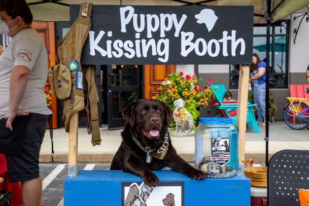 Stryker working the kissing booth  